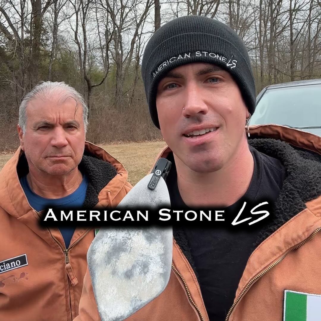 Luciano and Alex Sansalone, close-up, with a trowel and Italian flag patches on their work jackets