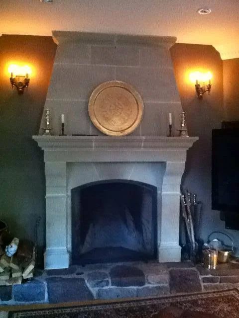 Indoor carved limestone fireplace surround